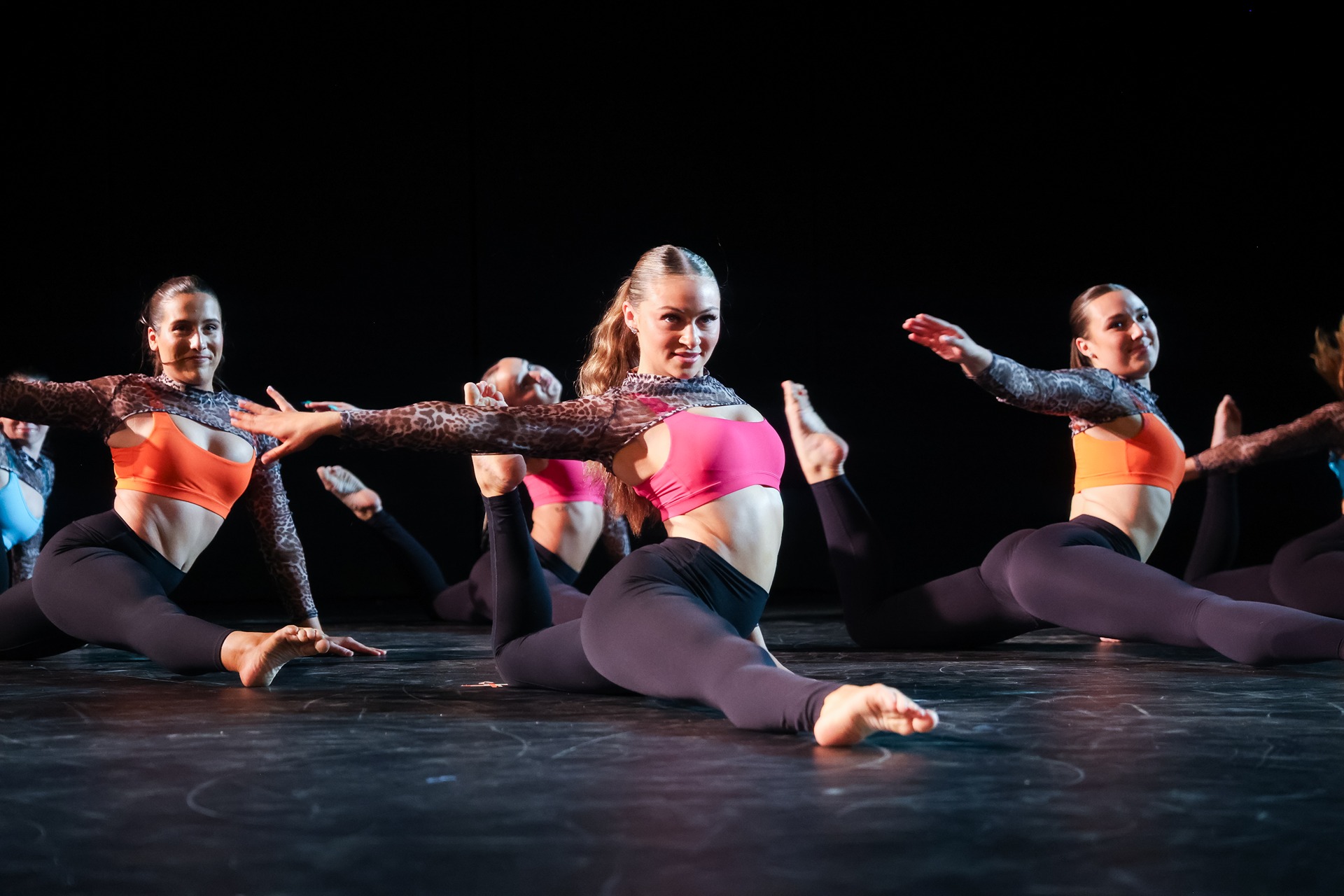 Students on the ground dancing in sync.