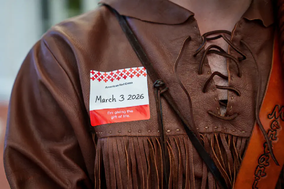 The mountaineer Mascot Buckskins cropped in on an American Red Cross Name tag with the date March 3, 2026 written on it.
