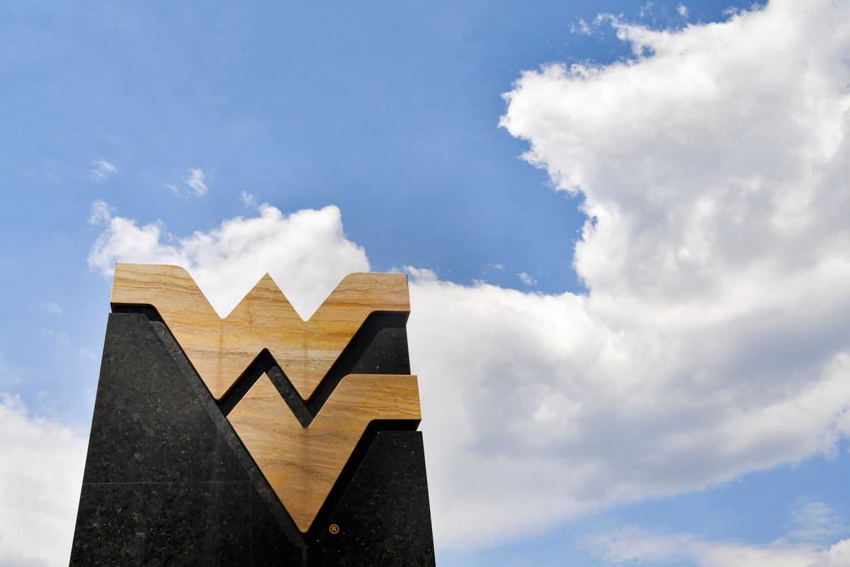 Flying WV sign with blue sky and clouds in the background